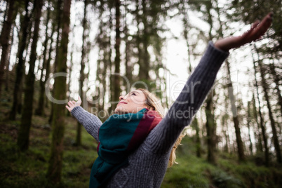 Beautiful woman standing with arms outstretched Beautiful woman standing with arms outstretched