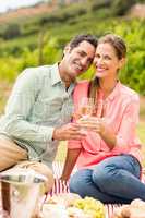 Happy couple holding glasses of wine