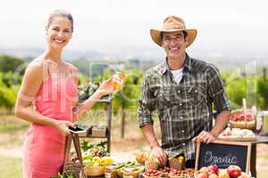 Portrait of farmer selling his organic produce to customer