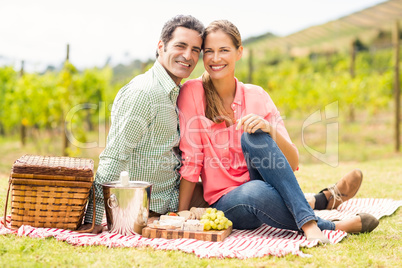 Portrait of happy couple relaxing on a blanket