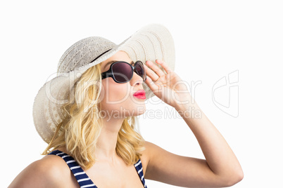 Beautiful woman posing with sunglasses against white background