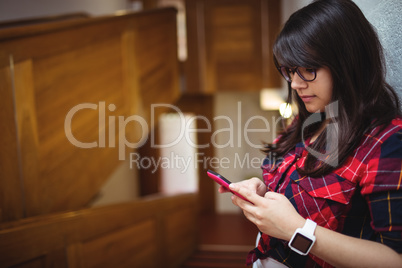 Female student using mobile phone