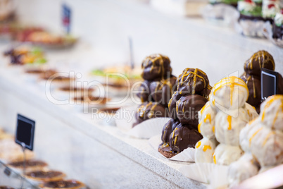 Close-up of desserts in display