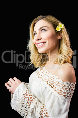 Beautiful smiling woman against black background