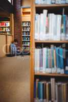 Student using laptop in library