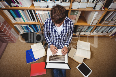 Student using laptop in library