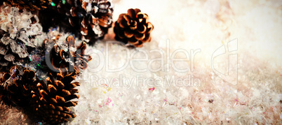 Pine cone decoration on fake snow