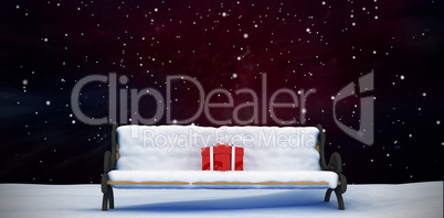 Composite image of digitally generated image of gift boxes on park bench