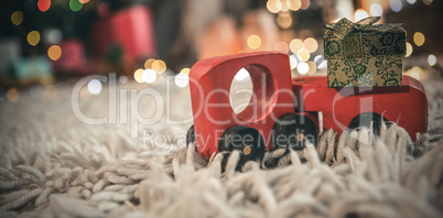 Toy car carrying christmas gift box