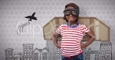 Composite image of smiling boy pretending to be pilot