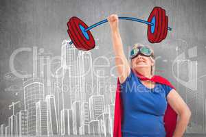 Composite image of senior woman disguise as superhero with hand raised