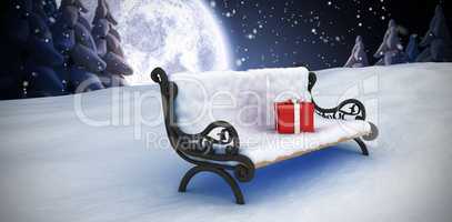 Composite image of gift box on park bench