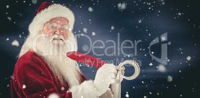 Composite image of father christmas writes a list