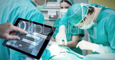 Composite image of man using tablet pc