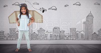 Composite image of standing girl with fake wings pretending to be pilot