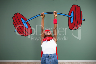 Composite image of smiling girl in red cape with arm raised