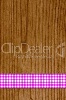 Tischdecke rosa weiß auf Holz Hintergrund