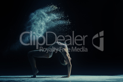 Concept photo. Female dancer in cloud of dust