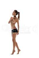 Nude. High slim girl posing dressed in loincloth