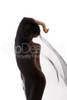 Graceful nude woman dancing with transparent cloth