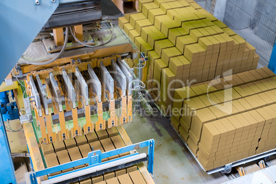 Brickyard. Top view of stacked bricks in workshop