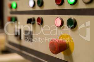 Close-up of red switch on remote control panel