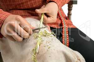 Basketry. Photo of boy barks a twig, close-up