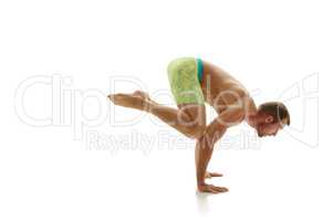 Male gymnast doing handstand. Isolated on white
