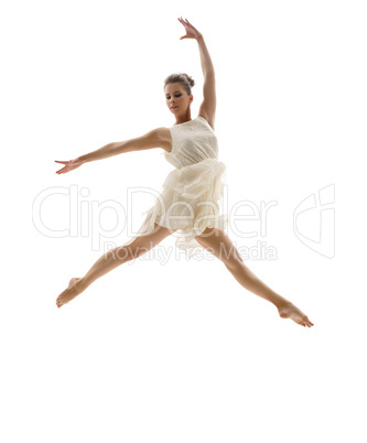 Beautiful ballerina posing in graceful leap