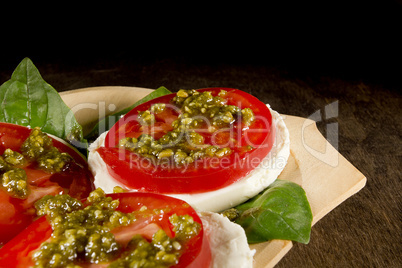 Caprese salad with mozzarella cheese tomatoes and basil