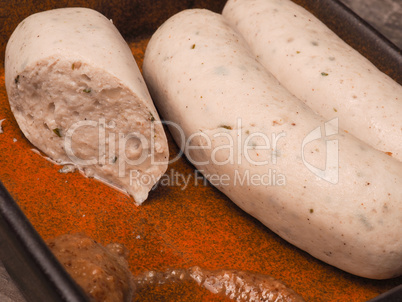 Bavarian sausage in a rustic ceramic bowl