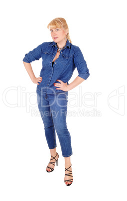 Woman in jeans clothing standing.