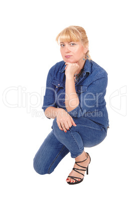 Woman kneeling on floor.