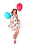 Lovely dancing woman with balloons.