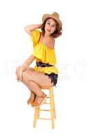 Gorgeous woman sitting on a chair.