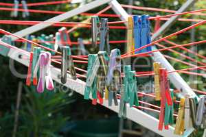 Close up of a colored clothespins on a clothesline