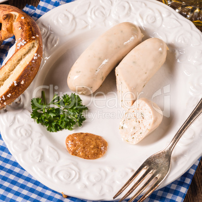 Bavarian sausage with pretzel, sweet mustard and beer