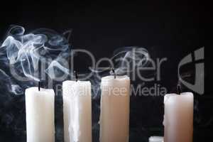 Extinguished Candles On Dark