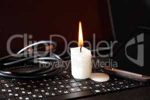 Candle On Laptop