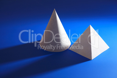White Taper And Pyramid On Blue