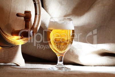 Glass Of Beer Near Barrel