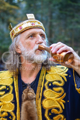 Old king drinking from the goblet