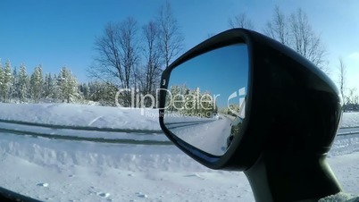 Driving on a Winter Road on a Sunny Day