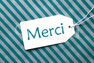 Label On Turquoise Wrapping Paper, Merci Means Thank You