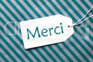 Label On Turquoise Wrapping Paper, Merci Means Thank You