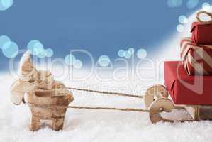 Reindeer With Sled, Light Blue Bokeh Background, Copy Space