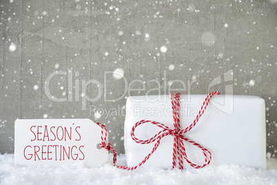 Gift, Cement Background With Snowflakes, Text Seasons Greetings