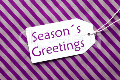 Label On Purple Wrapping Paper, Text Seasons Greetings