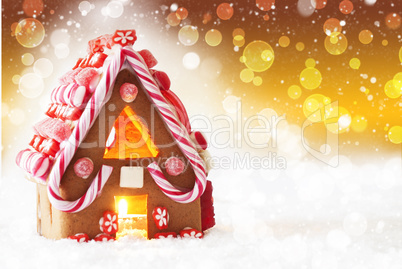 Gingerbread House, Golden Background With Bokeh And Snowflakes, Copy Space