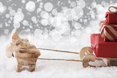 Reindeer With Sled, Silver Stars And Bokeh Background, Copy Space